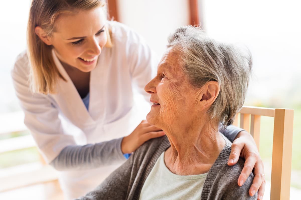 Caregiver connecting with a senior resident