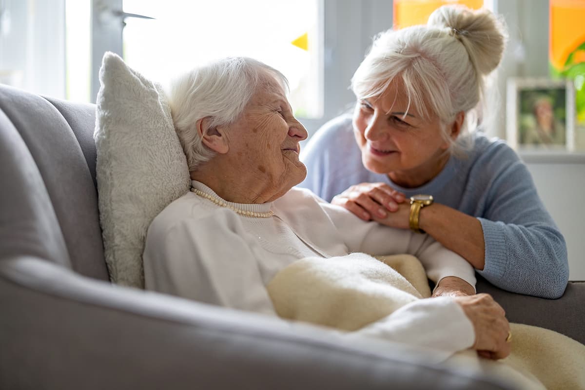 Family member visiting with elderly resident